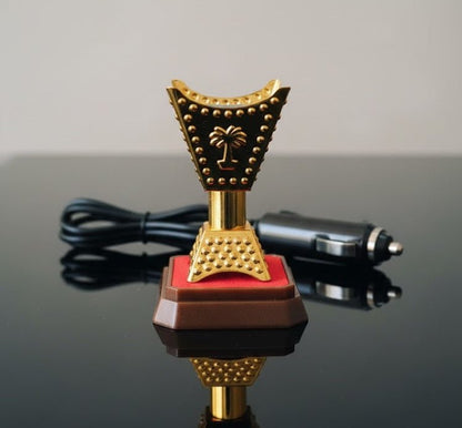 Car bakhoor incense burner plugged into 12V socket