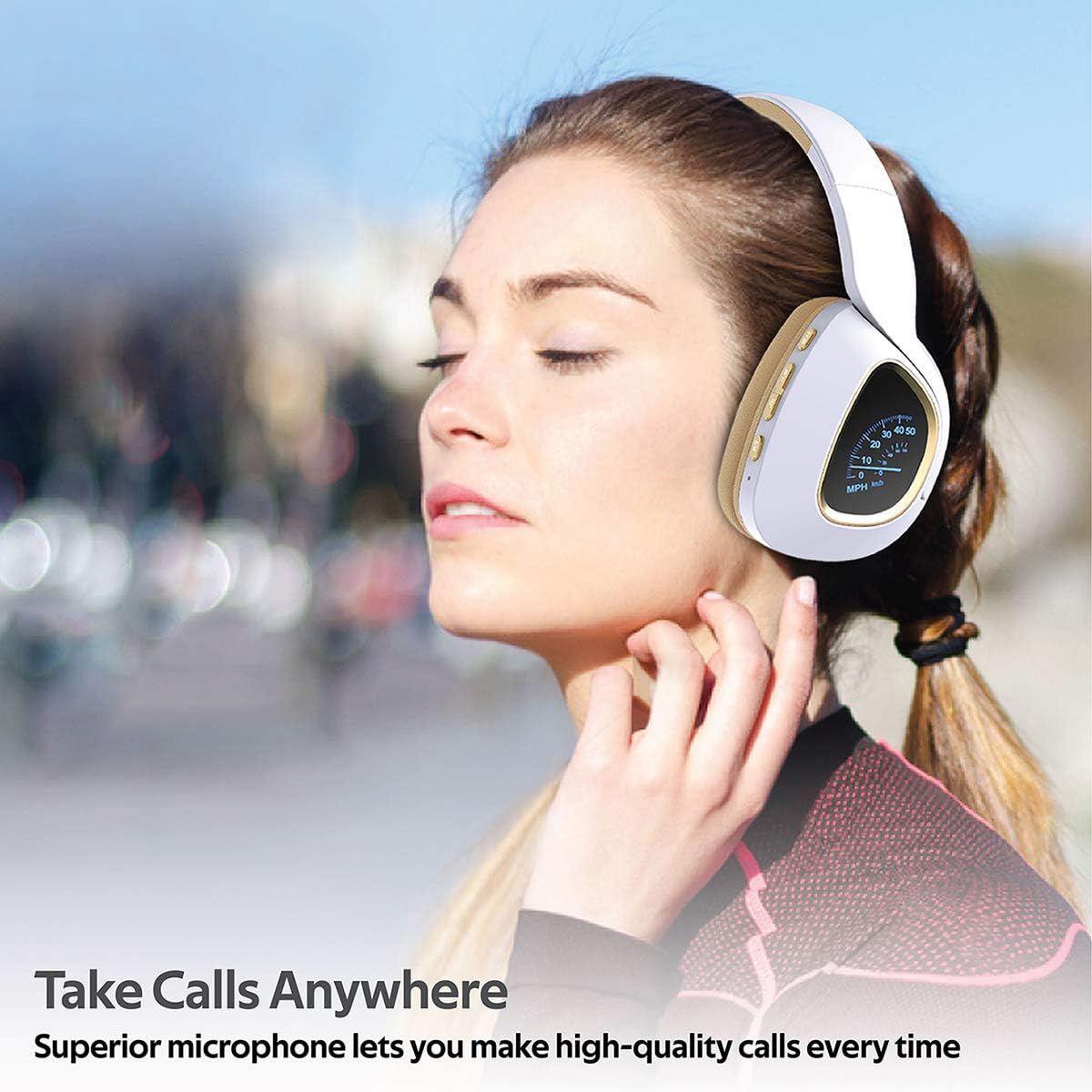 Person wearing wireless headphones with LED display lit up